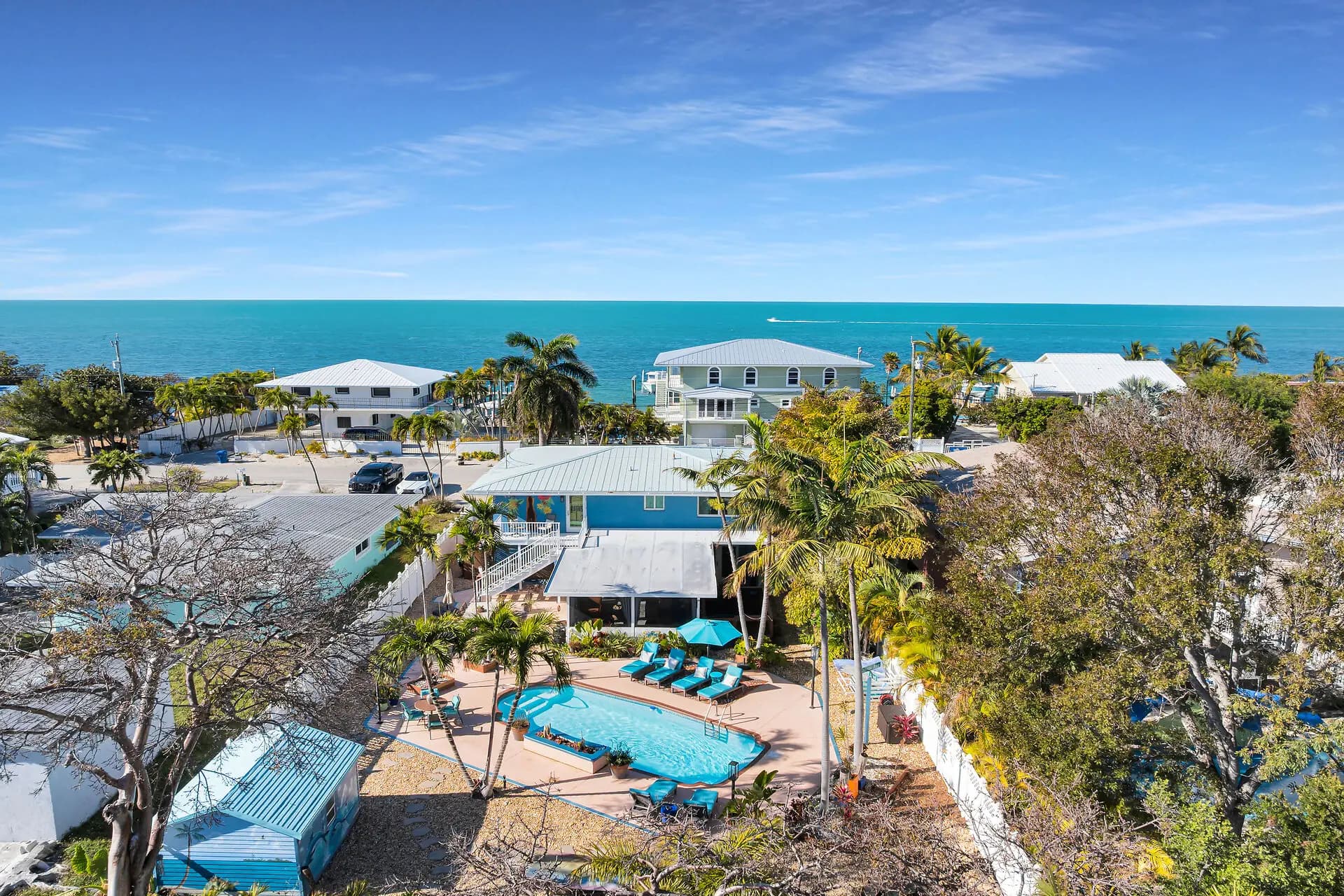 Aerial view of The Salty Bitch with its private pool deck and the Gulf of Mexico beyond